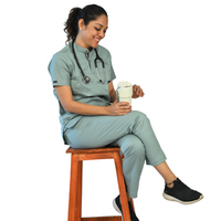 Explore our elegant subtle mint scrubs, crafted from comfortable cotton stretchable fabric, perfect for healthcare professionals enduring long working days. Available in various sizes, these scrubs offer a flattering fit to enhance your comfort. Personalize your attire with name and logo customization options. Elevate your workwear with style and functionality tailored to your needs.